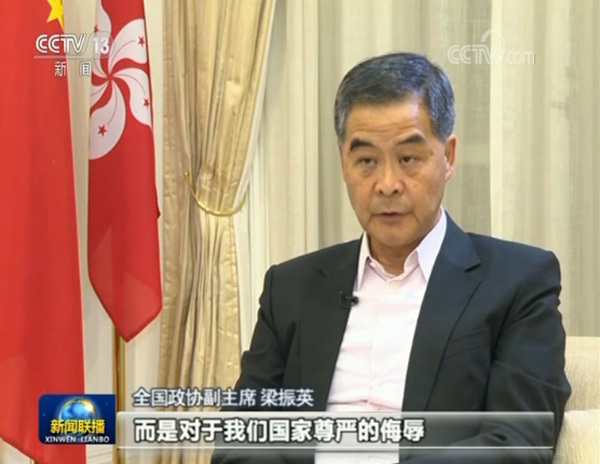 新闻联播首曝光暴徒乱港画面:污损国徽 围堵中联办